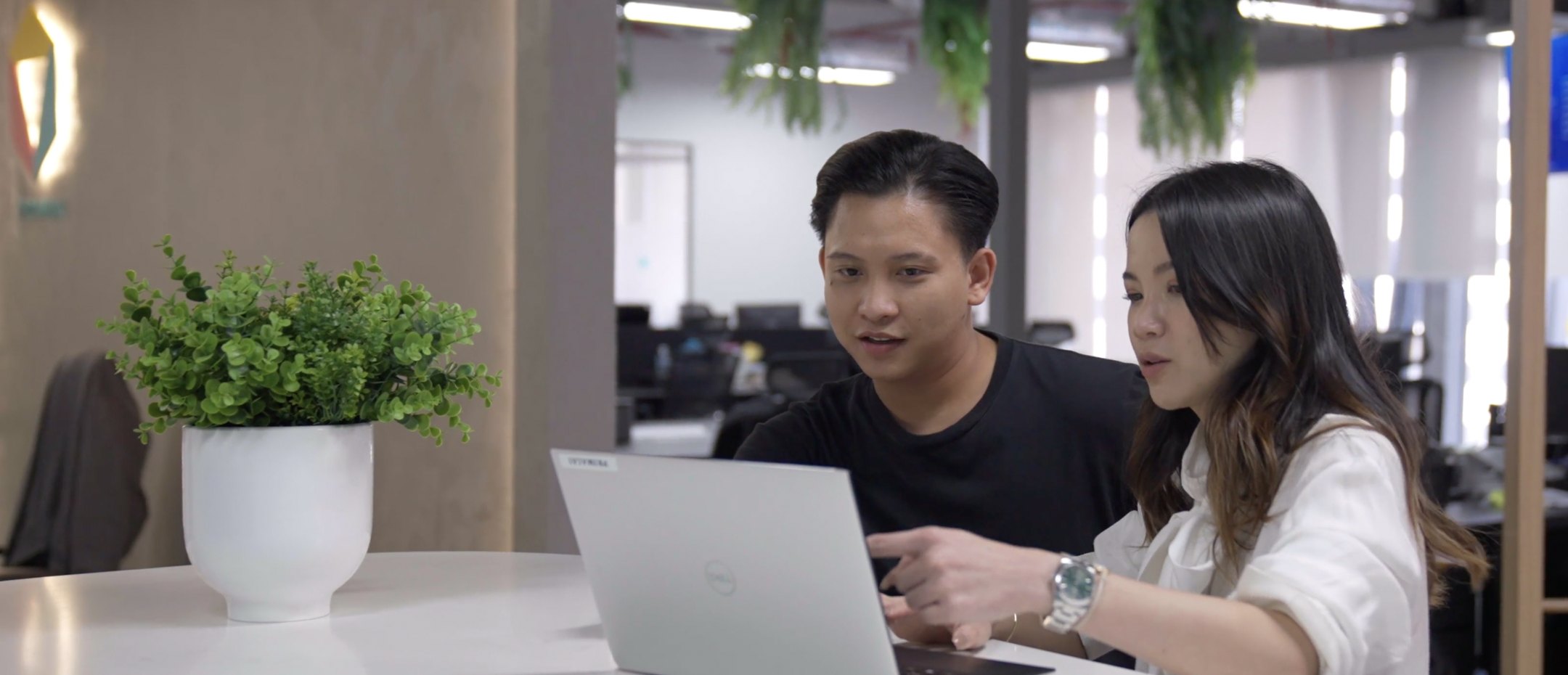 The Primal team working together at a laptop in the office