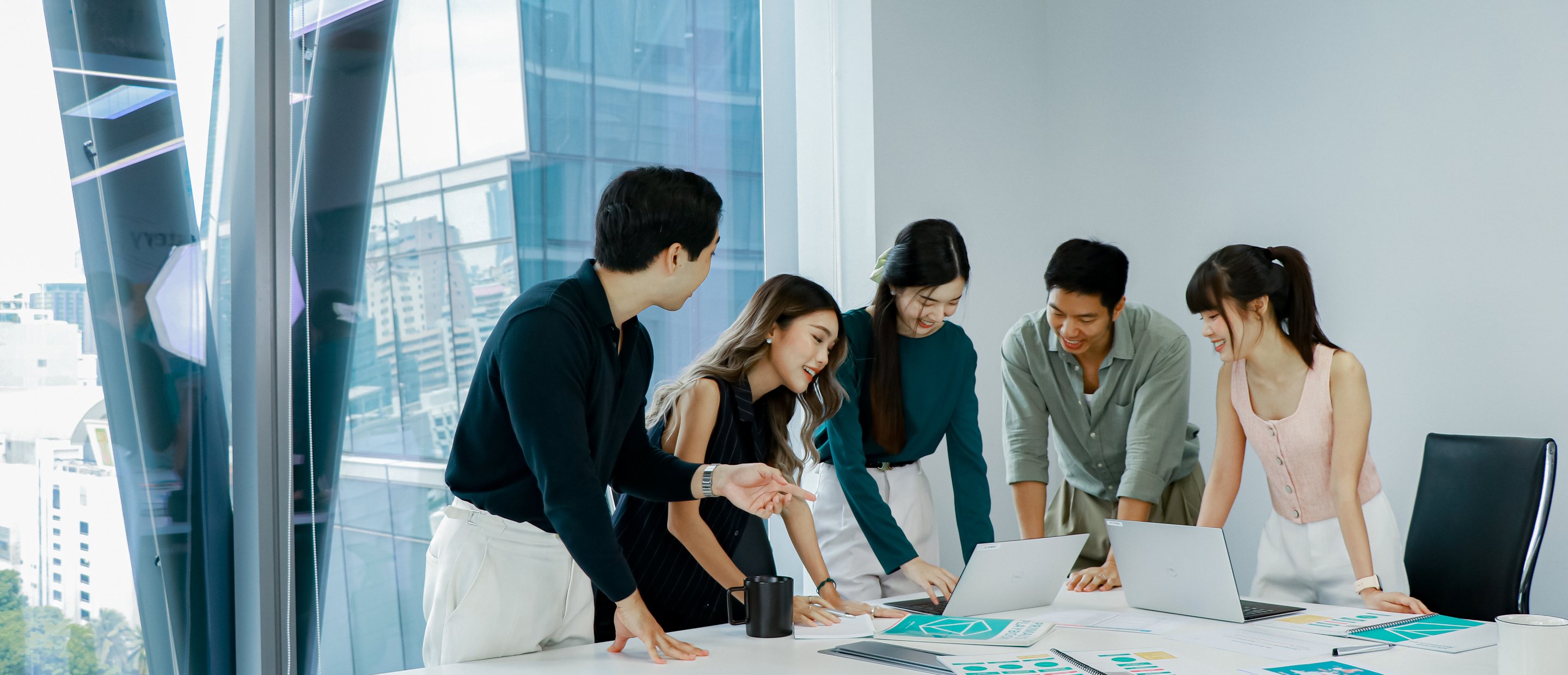 Primal team reviewing a marketing plan around the meeting table